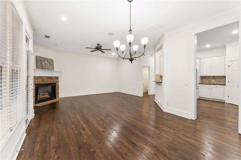 4428 Wilkerson Manor Drive, Unit 6 Smyrna, GA 30080 - Photo 9 of 27 a view of a room with wooden floor and a kitchen