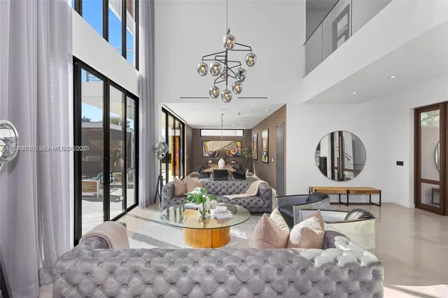 a view of a living room and workspace