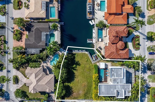 an aerial view of houses with outdoor space