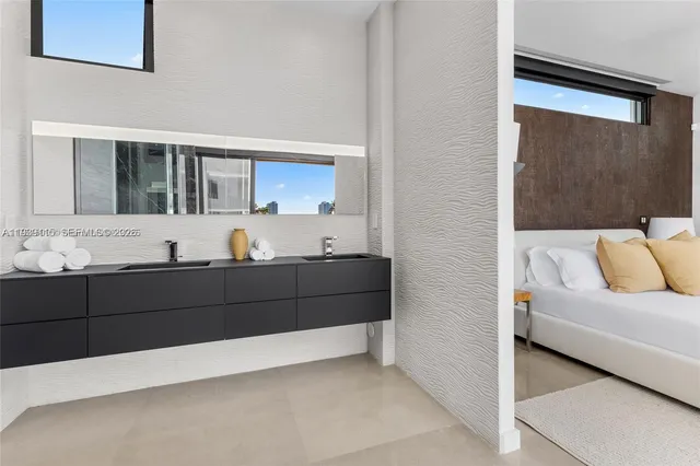 a living room with a couch and a sink