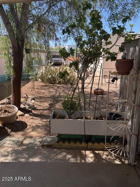 19225 North Cave Creek Road, Unit 83 Phoenix, AZ 85024 - Photo 7 of 10 a view of a street with a tree