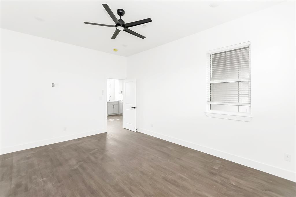 1101 Poindexter Street, Unit A2 Fort Worth, TX 76102 - Photo 13 of 40 a view of empty room with wooden floor
