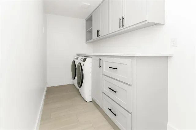 a view of walk in closet with cabinet