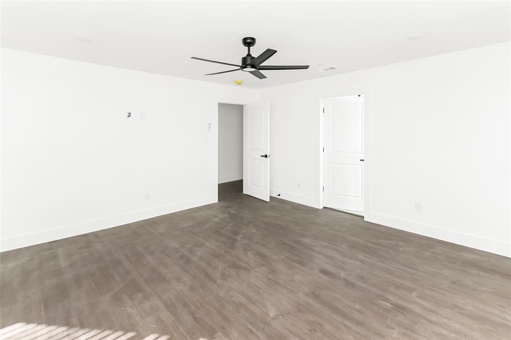 1101 Poindexter Street, Unit A2 Fort Worth, TX 76102 - Photo 20 of 40 a view of a room with wooden floor