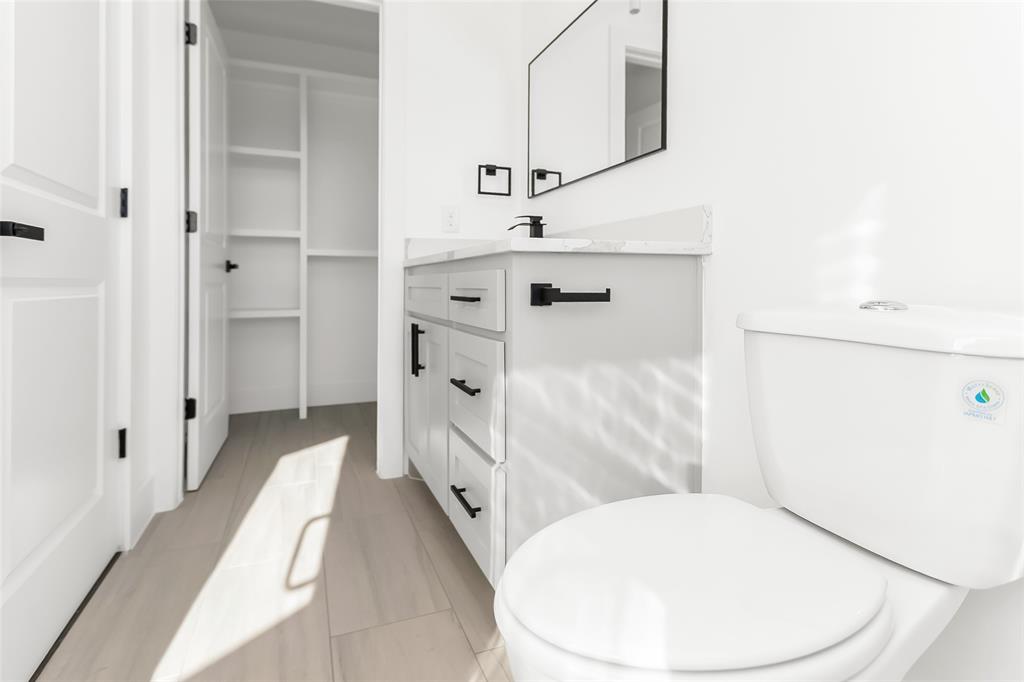 1101 Poindexter Street, Unit A2 Fort Worth, TX 76102 - Photo 23 of 40 a bathroom with a sink a toilet and shower