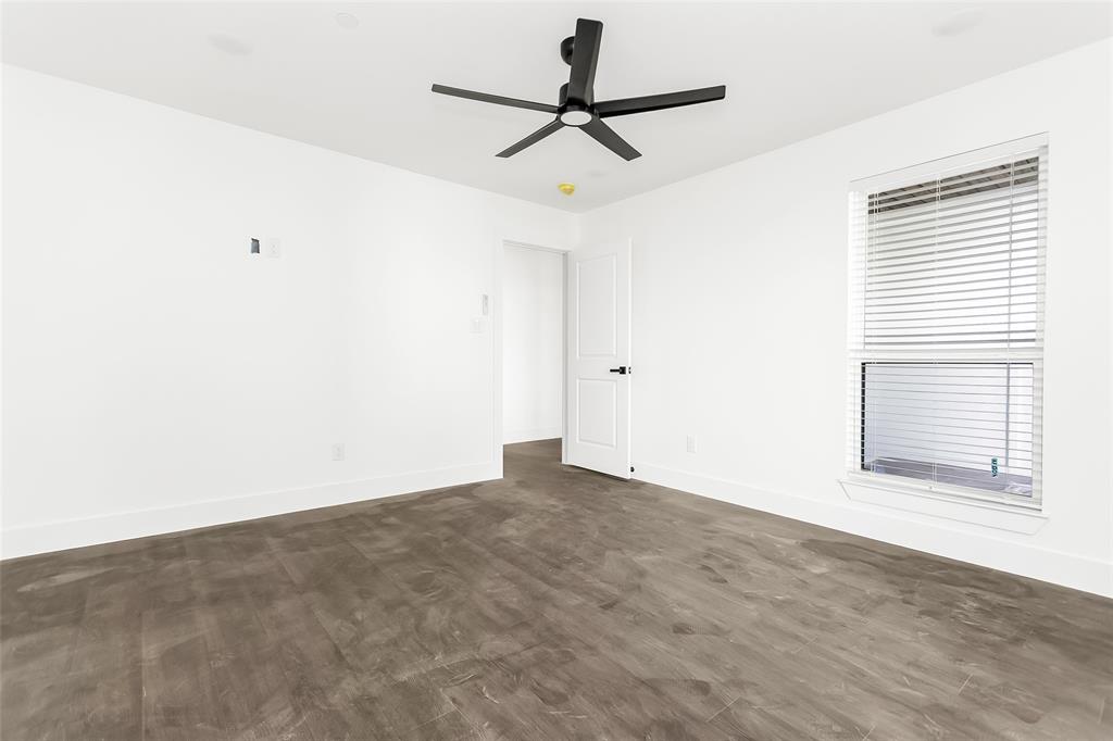 1101 Poindexter Street, Unit A2 Fort Worth, TX 76102 - Photo 26 of 40 a view of a livingroom with a ceiling fan and window