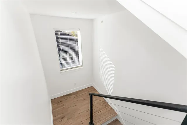 a view of a balcony with wooden floor