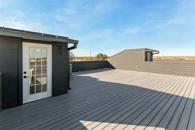 a house with wooden floor and lake view