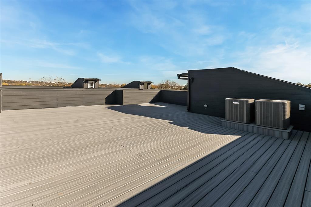 1101 Poindexter Street, Unit A2 Fort Worth, TX 76102 - Photo 36 of 40 a house with wooden floor and lake view