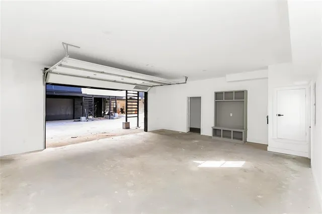 an aerial view of residential houses with city view