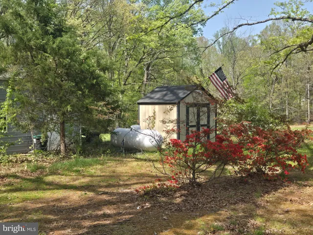 a view of a house with a tree