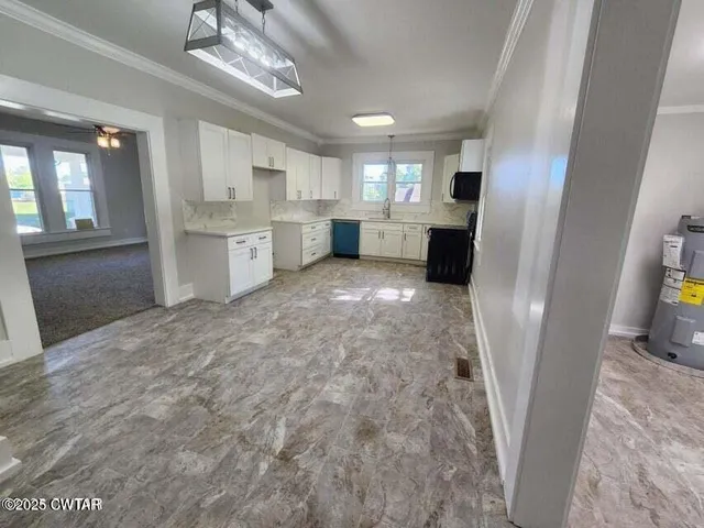 a view of a kitchen with a sink cabinets and a window