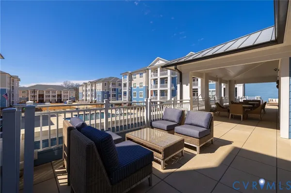 a view of a balcony with chairs