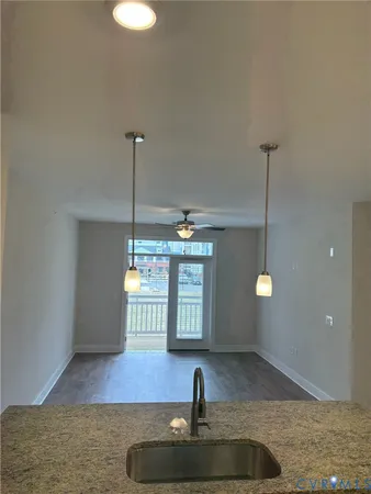 a view of a hall way with furniture