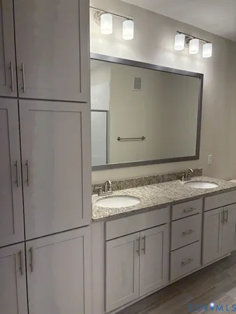 a bathroom with a sink and mirror