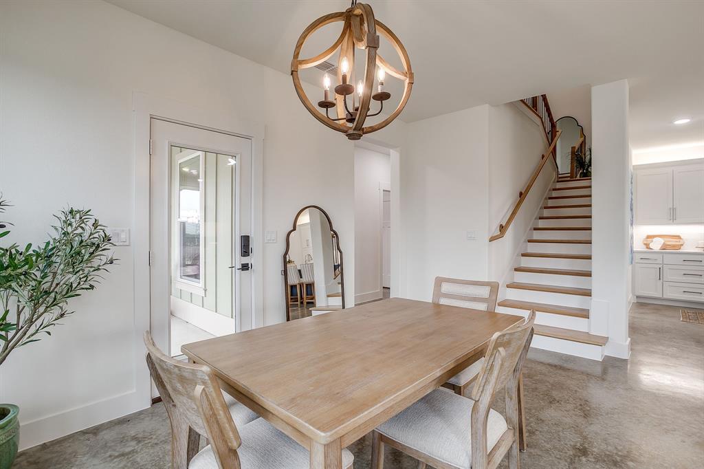 110 Cardinal Wds Granbury, TX 76049 - Photo 14 of 29 a view of a dining room with furniture and wooden floor