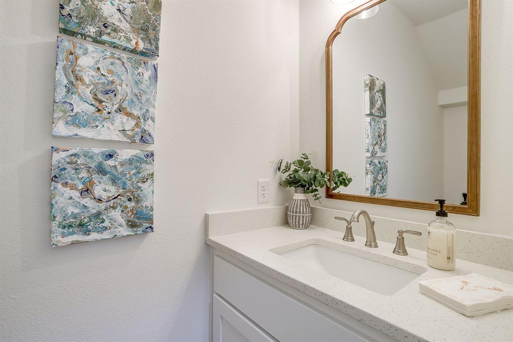 110 Cardinal Wds Granbury, TX 76049 - Photo 15 of 29 a bathroom with a sink and a mirror