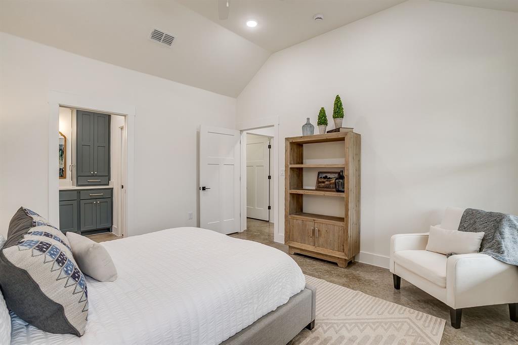 110 Cardinal Wds Granbury, TX 76049 - Photo 18 of 29 a bedroom with a bed and a couch