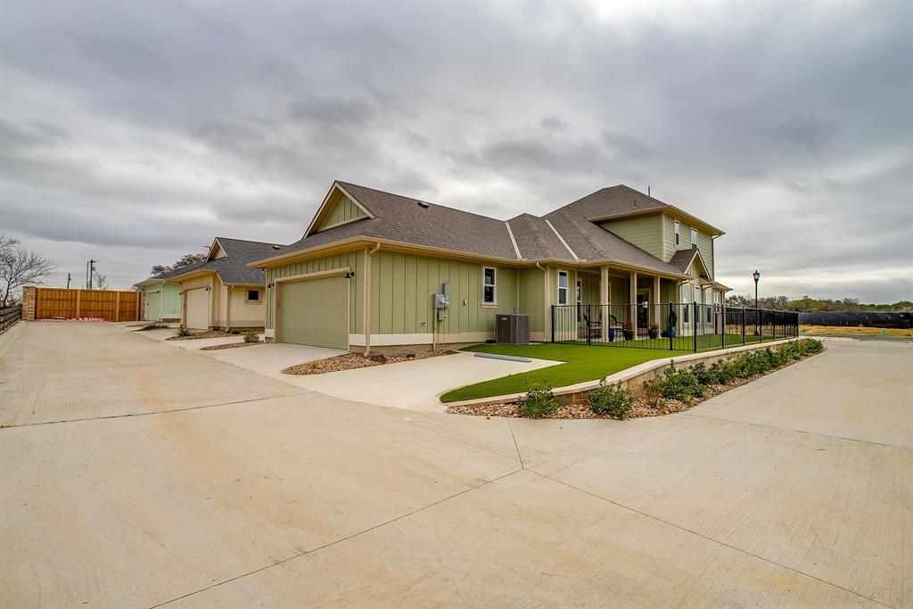 110 Cardinal Wds Granbury, TX 76049 - Photo 24 of 29 a view of an house with backyard and parking