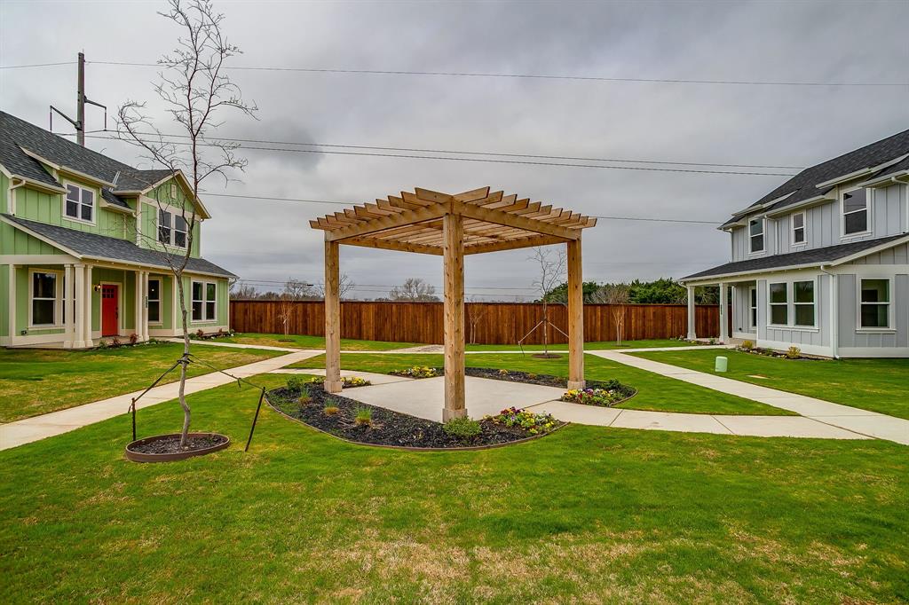 110 Cardinal Wds Granbury, TX 76049 - Photo 27 of 29 a house view with a sitting space and garden view