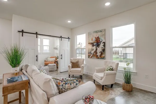 a living room with furniture and a window