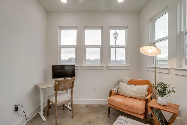a living room with furniture and a window