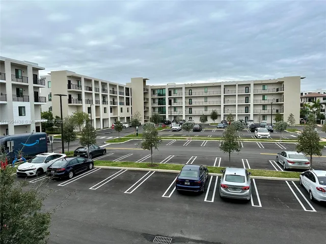 a kitchen with a sink a microwave and refrigerator