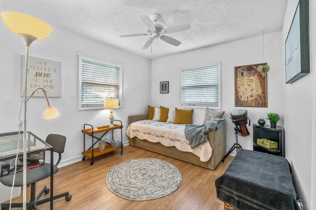 a bed room with furniture and a window