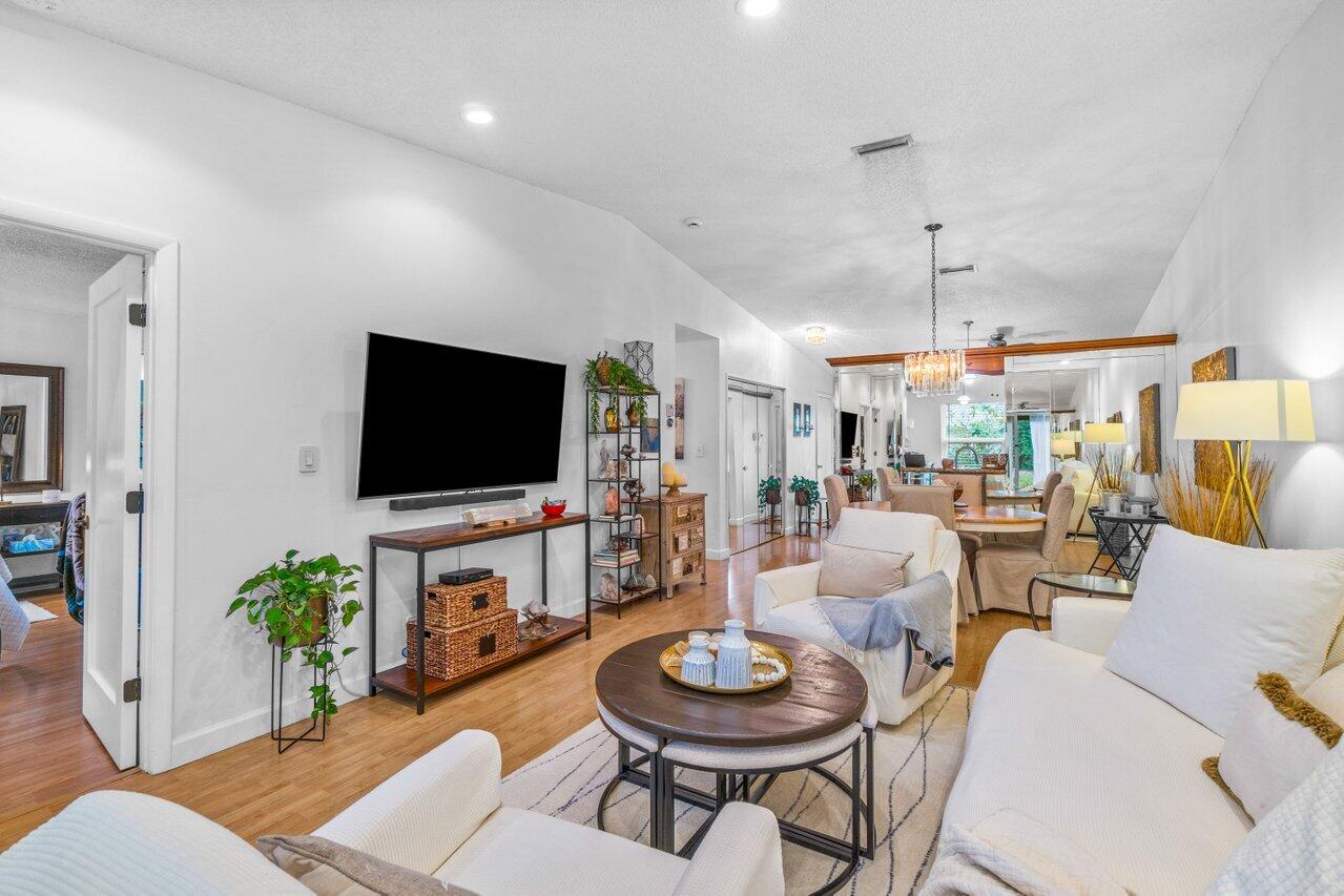 18855 Candlewick Drive Boca Raton, FL 33496 - Photo 17 of 27 a living room with furniture and a flat screen tv