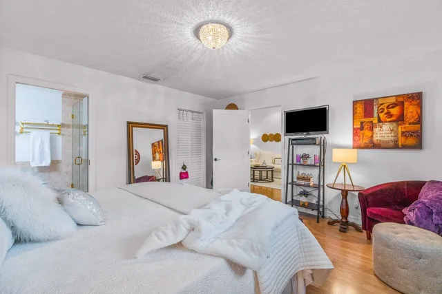 a bedroom with a bed and a couch