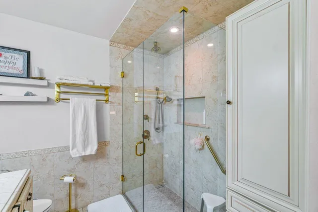 a bathroom with a shower and a tub