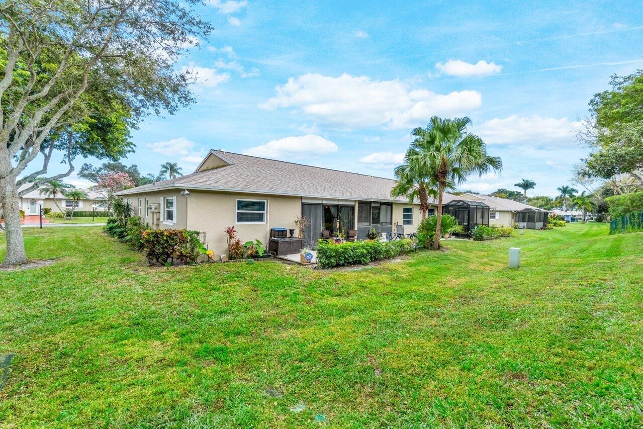 18855 Candlewick Drive Boca Raton, FL 33496 - Photo 27 of 27 a front view of a house with garden