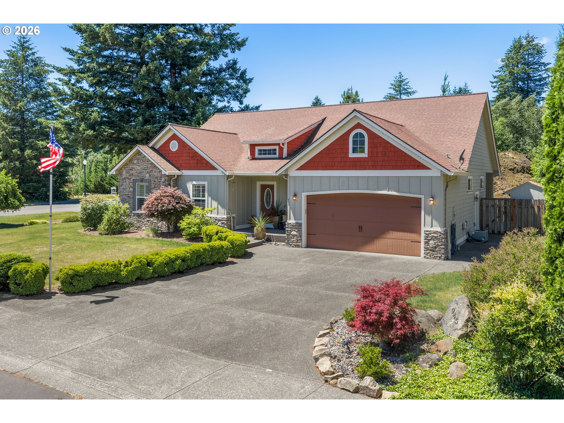 945 Northwest Angel Heights Road Stevenson, WA 98648 - Photo 41 of 41 a front view of a house with a yard and garage