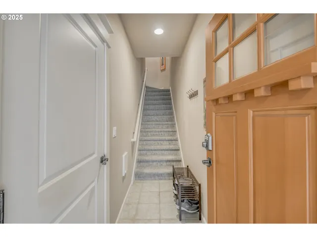 a view of entryway with stairs and wooden floor