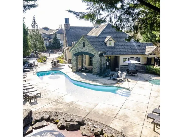 a view of a house with a porch and a trees