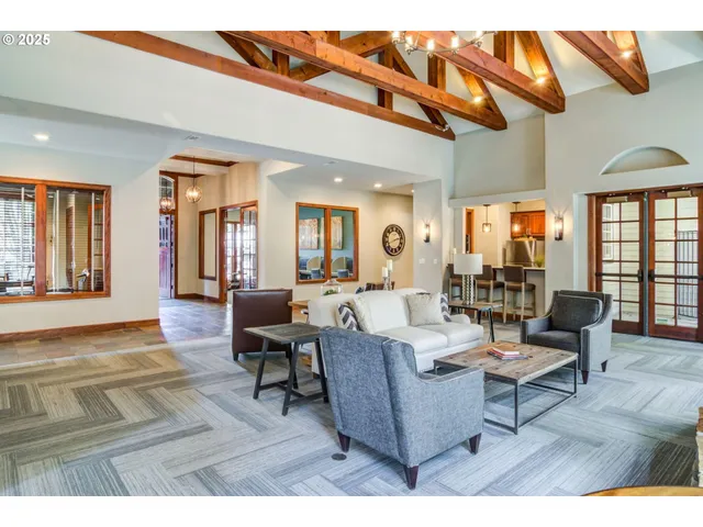 a view of a patio with table and chairs and potted plants