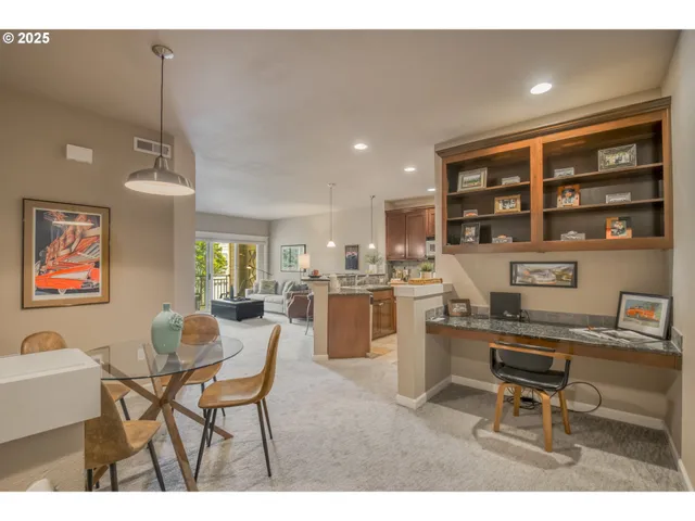 a dining room with a table and chairs