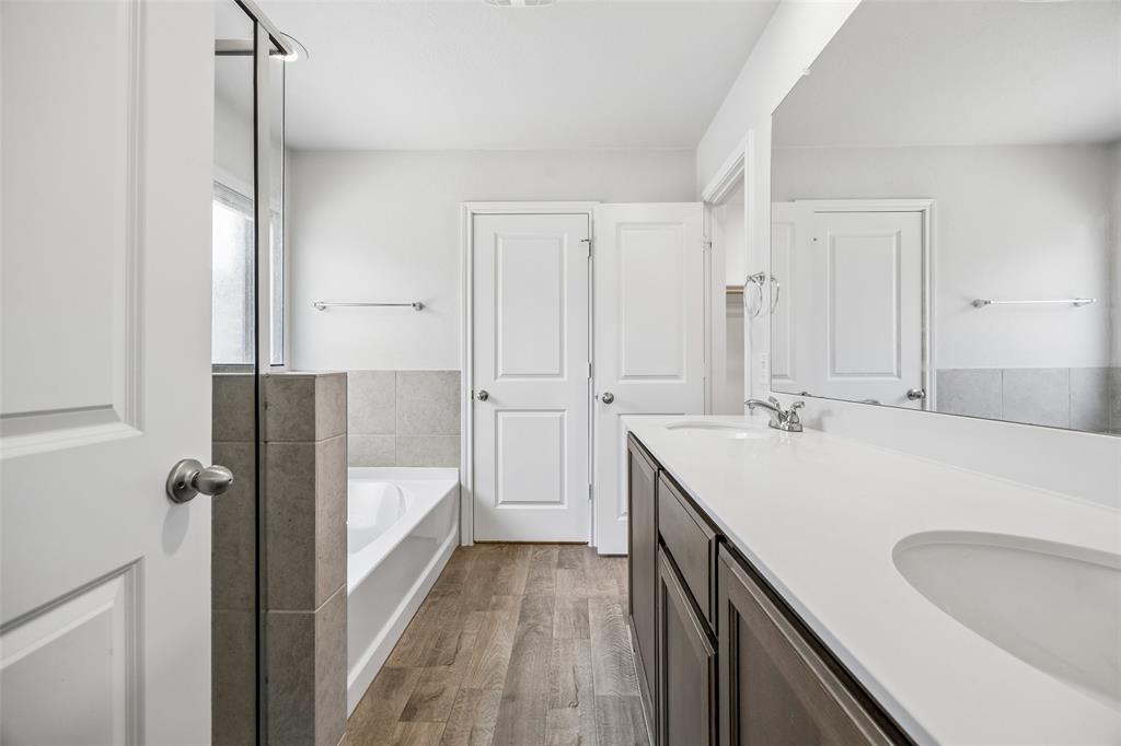 3807 Dogwood Road Melissa, TX 75454 - Photo 25 of 38 a bathroom with a double vanity sink and mirror