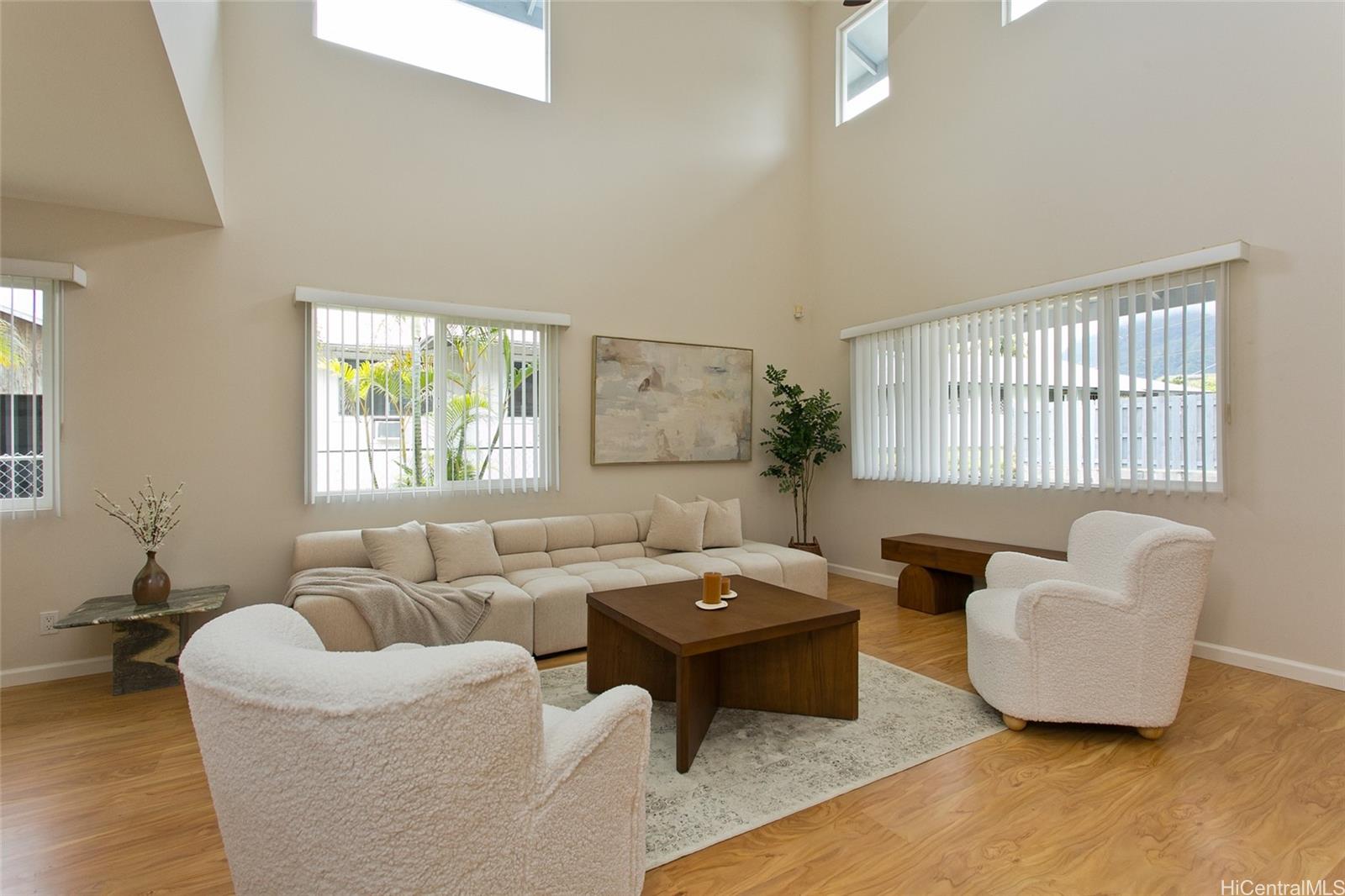 45-510 Mahinui Road, Unit C Kaneohe, HI 96744 - Photo 1 of 1 a living room with furniture and a window
