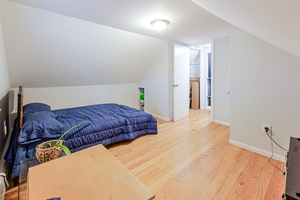 5 Oliver Street Randolph, MA 02368 - Photo 27 of 29 a bedroom with a bed and a cabinets