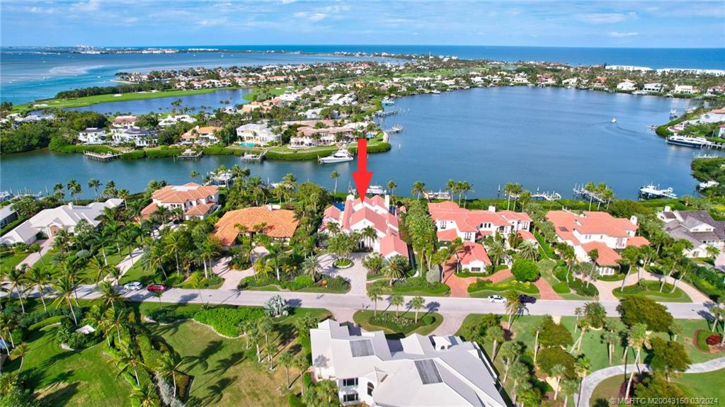 6996 Southeast Harbor Circle Stuart, FL 34996 - Photo 4 of 73 an aerial view of a houses with a lake view