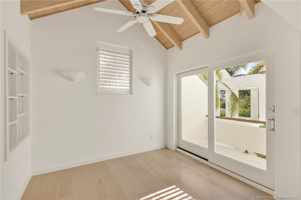 6996 Southeast Harbor Circle Stuart, FL 34996 - Photo 45 of 73 Guest bedroom sitting area with balcony overlooking courtyard