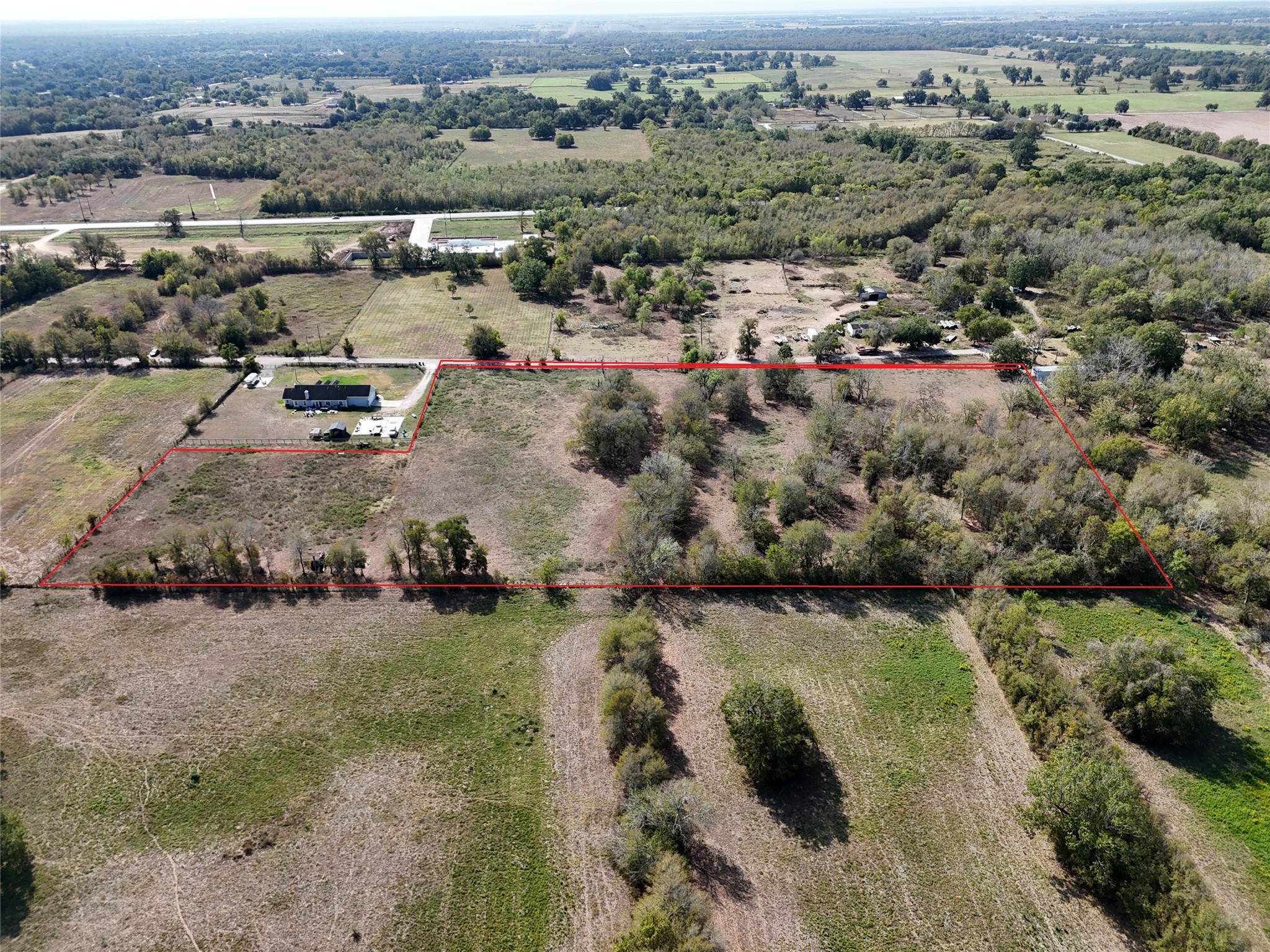 0 Reynolds Road Fulshear, TX 77441 - Photo 4 of 4 an aerial view of a houses with a lake view