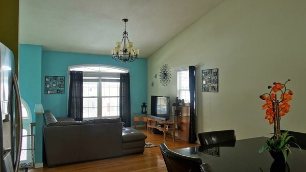 24 Curtis Street Springfield, MA 01119 - Photo 6 of 17 a living room with furniture and a window