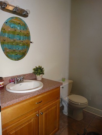 24 Curtis Street Springfield, MA 01119 - Photo 8 of 17 a bathroom with a sink and a mirror