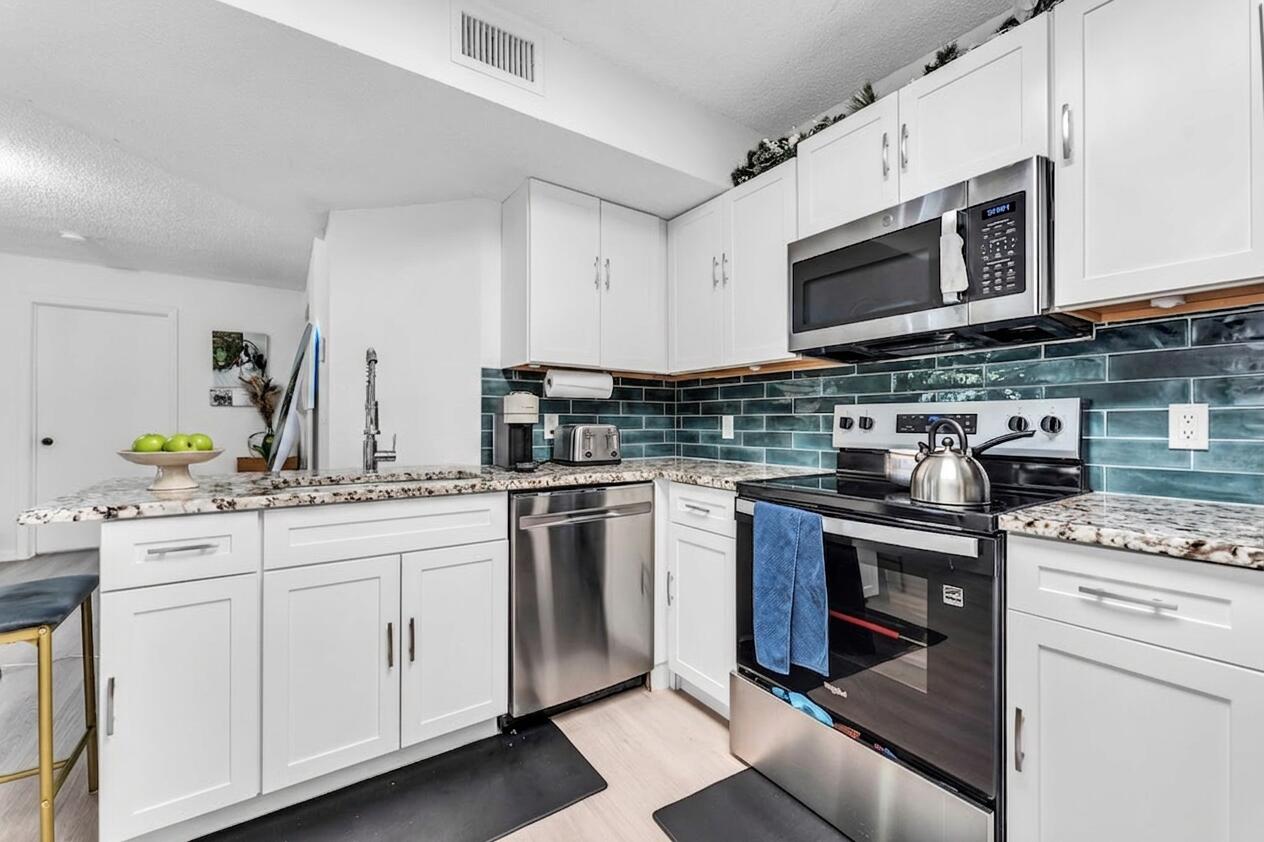 8721 Wiles Road, Unit 103 Coral Springs, FL 33067 - Photo 6 of 25 Decluttered Kitchen
