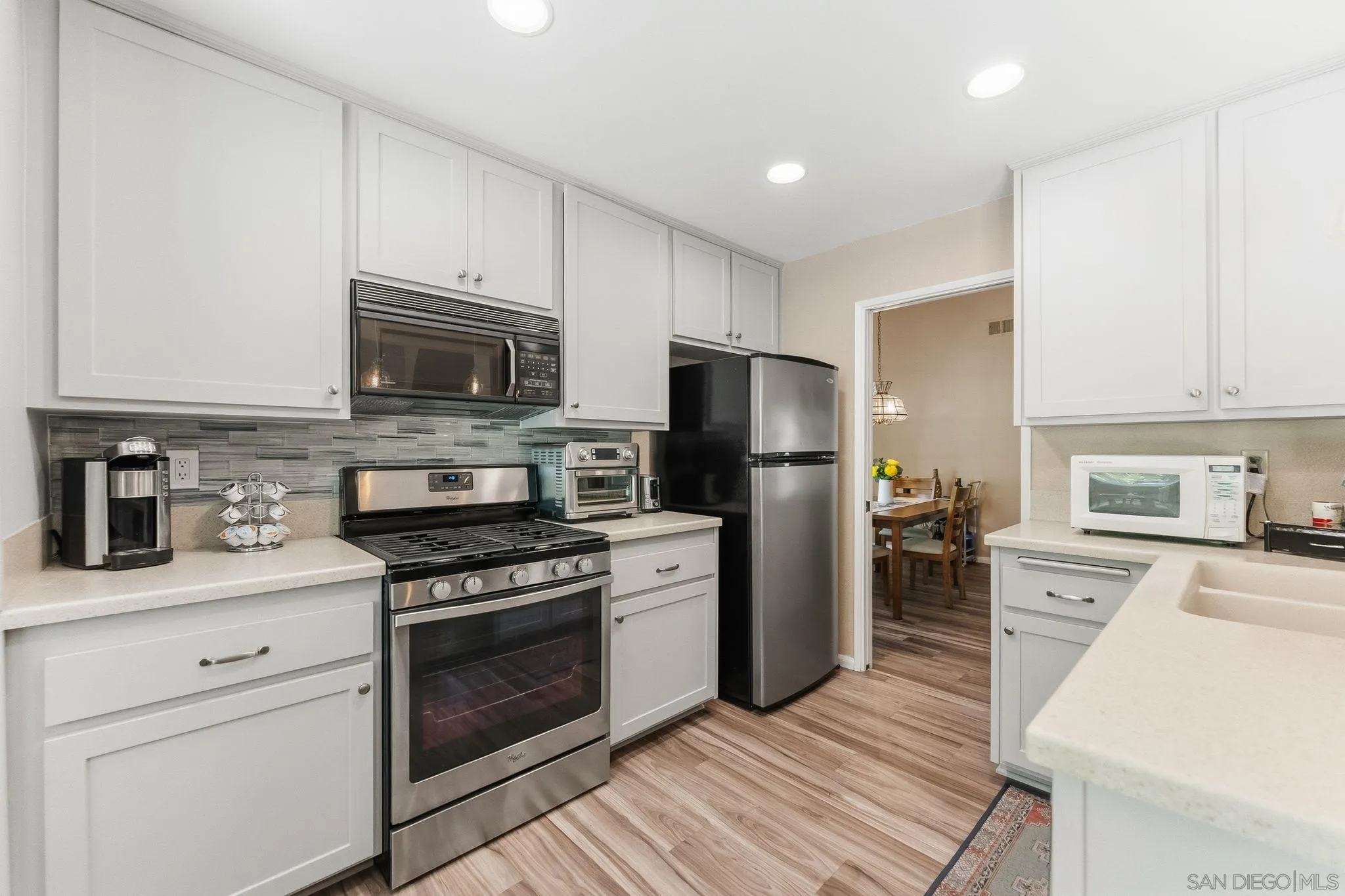 10565 Strathmore Drive Santee, CA 92071 - Photo 16 of 59 a kitchen with a refrigerator stove and microwave