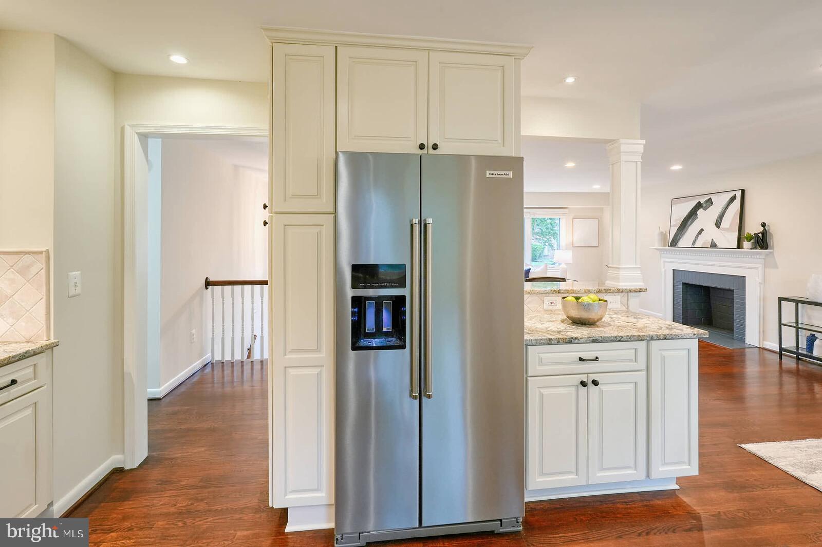 6511 Engel Drive McLean, VA 22101 - Photo 19 of 56 a open kitchen with white cabinets and stainless steel appliances