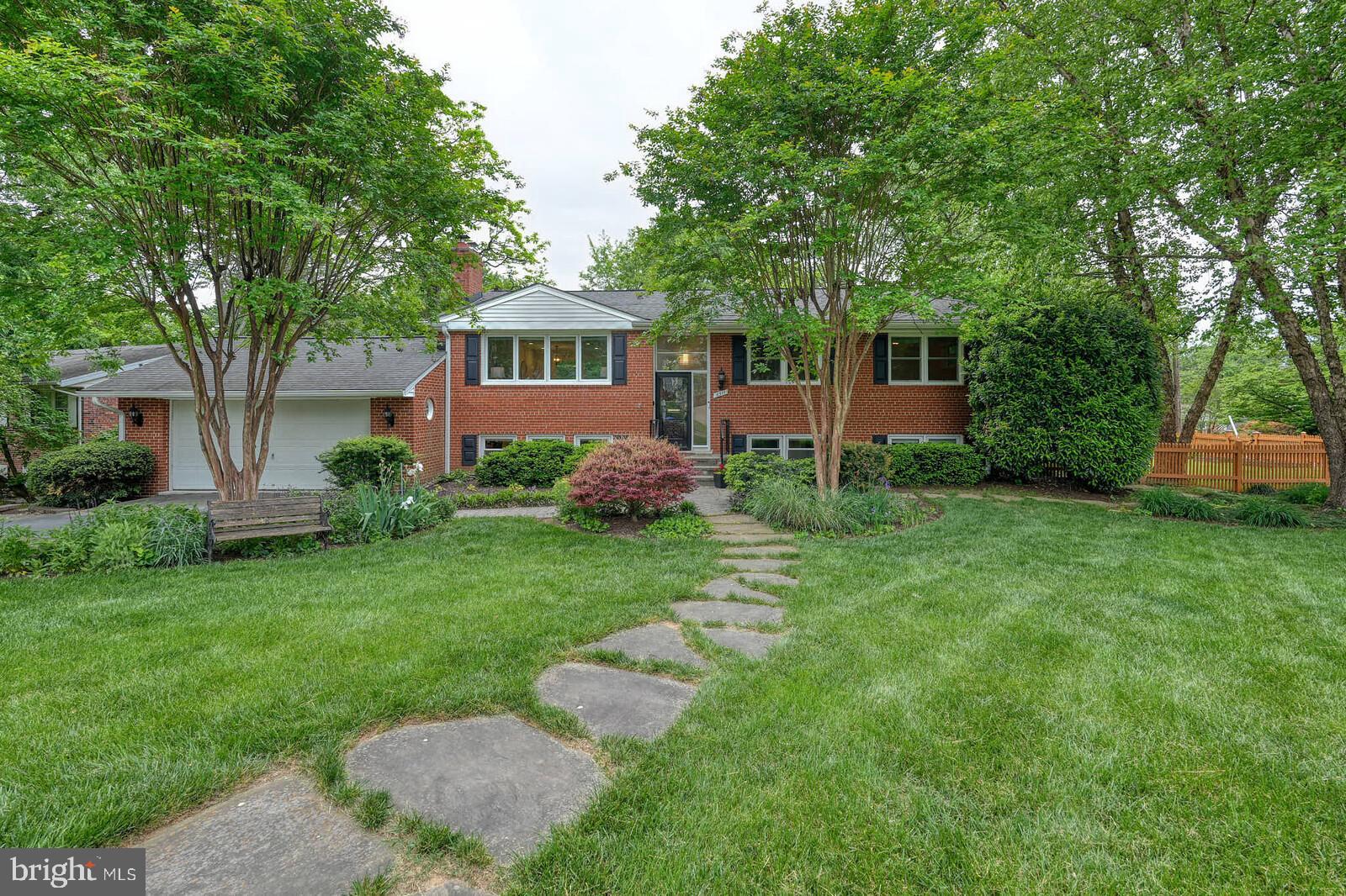 6511 Engel Drive McLean, VA 22101 - Photo 2 of 56 a front view of a house with garden