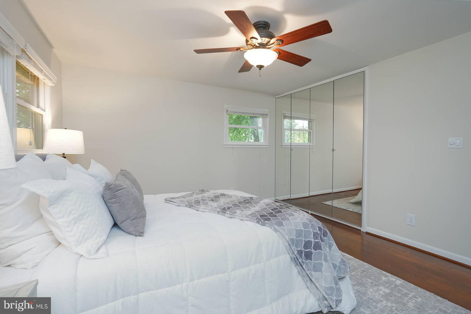 6511 Engel Drive McLean, VA 22101 - Photo 22 of 56 a bedroom with a large bed and a ceiling fan
